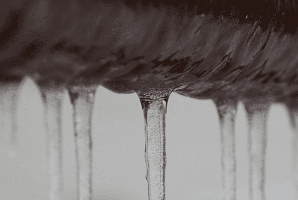 Icicles hanging off a frozen pipe